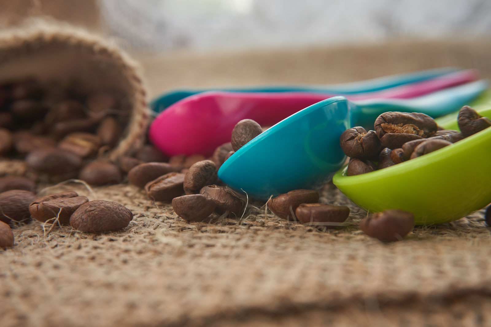 image of plastic cups of coffee beans